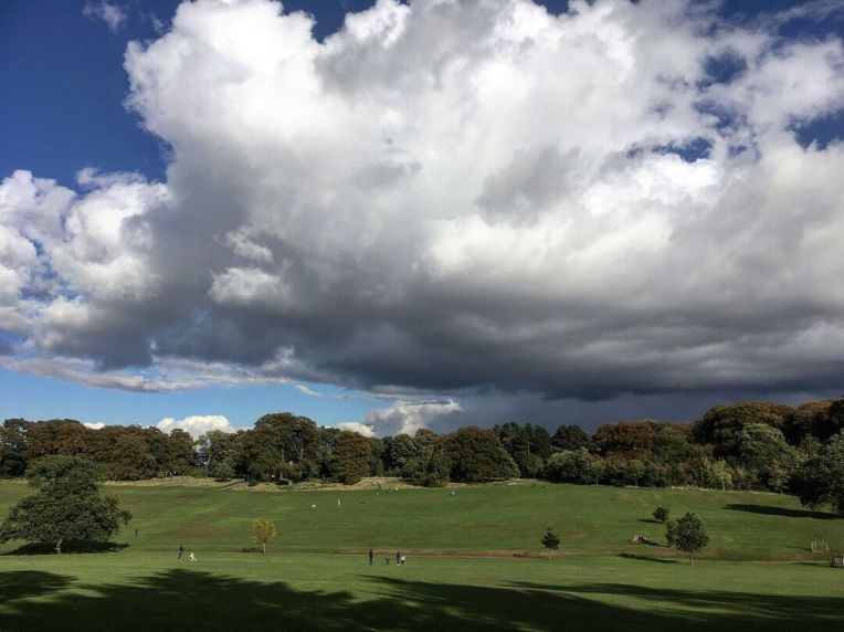 Cloudscape across the designed landscape at Warley Woods Park.