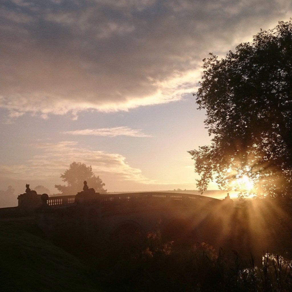 Sunrise over the Sphinx bridge at Compton Verney in Warwickshire 